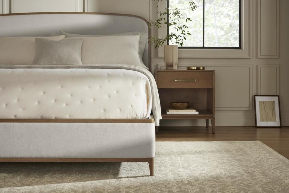 The Upholstered Curve bed in Sand and Single Drawer Wood Nightstand in Bluff by Boll & Branch