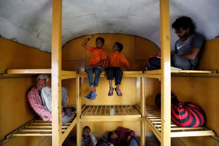 The Wider Image: The Indian children who take a train to collect water