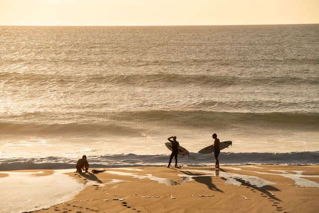 <p>Ambroise Tézenas</p> Surfers on the beach near Les Hortensias du Lac hotel, in Hossegor.