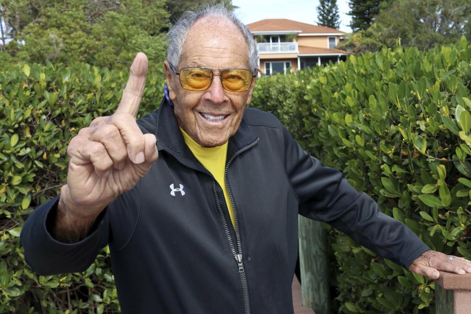 Tennis coach Nick Bollettieri gestures outside his home Thursday, Jan. 7, 2021, in Bradenton, Fla