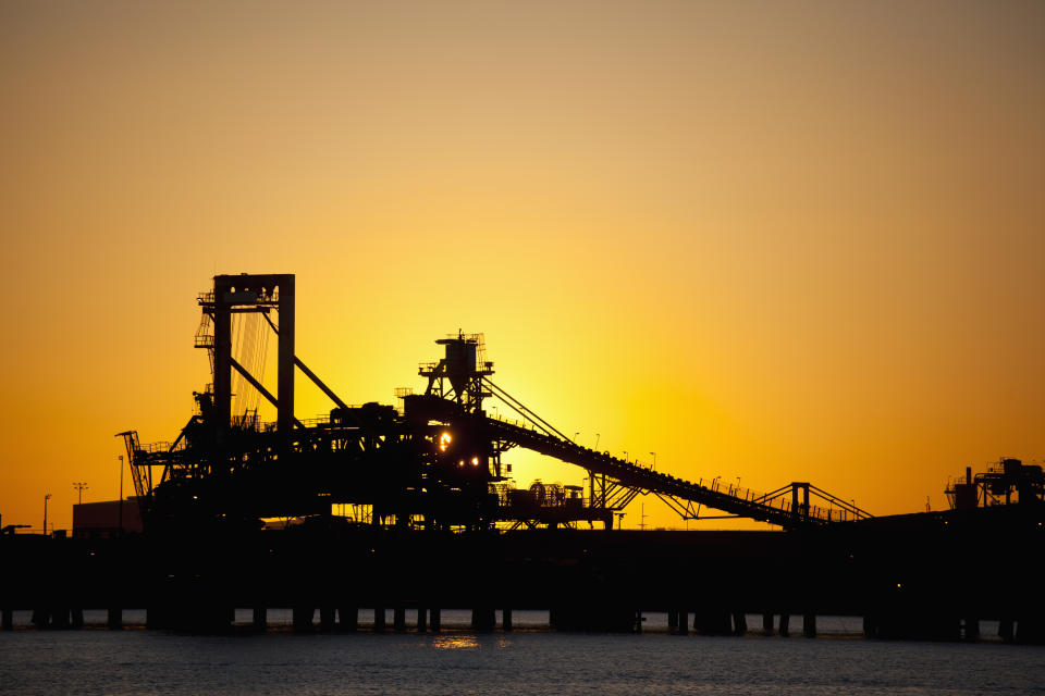 Silhouette of a bucket wheel reclaimer at an iron ore mine