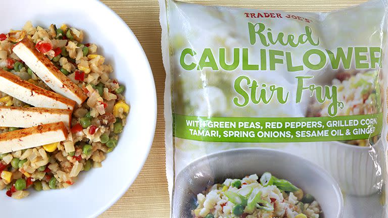 Trader Joe's Riced Cauliflower Stir-Fry package with plate of cooked product beside it