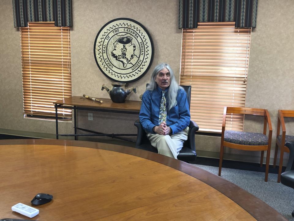 In an April 26, 2019 photo, Catawba Indian Nation Chief Bill Harris talks about how his South Carolina-based tribe is trying to get permission to build a casino in North Carolina but is getting heavy opposition from the Eastern Band of Cherokee Indians, during an interview at the Catawba’s reservation near Rock Hill, S.C. The Catawbas want to build their casino near Kings Mountain, North Carolina, and have the backing of U.S. senators from both Carolinas. (AP Photo/Jeffrey Collins)