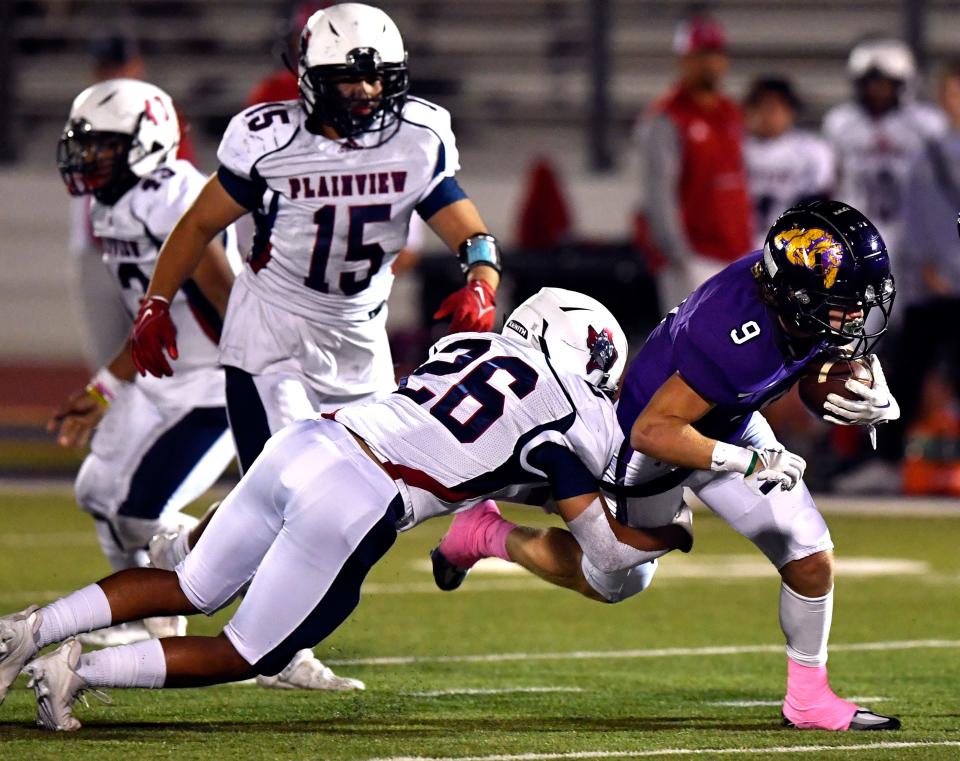 Wylie running back Henry Curington pushes through the defense during Friday's against Plainview.