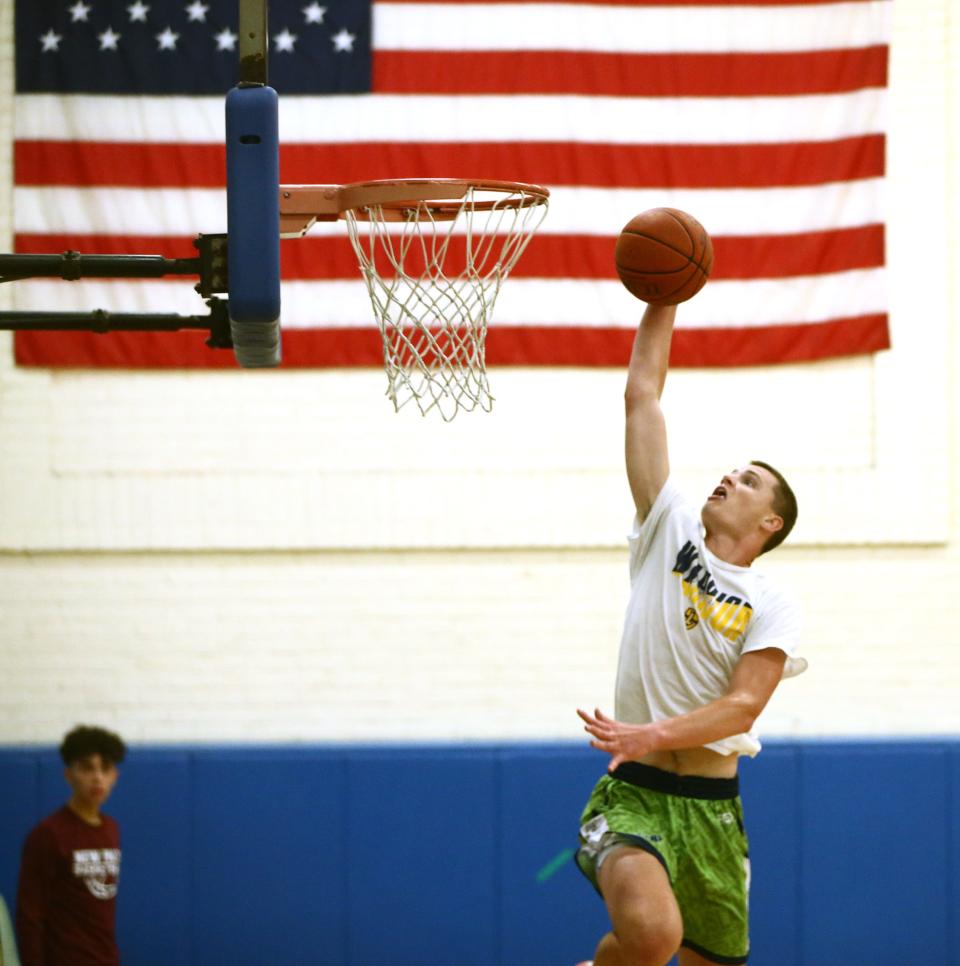 Our Lady of Lourdes' Patrick Faughnan goes for a slam dunk while practicing with the BCANY Mid-Hudson boys basketball team in Wallkill on July 24, 2023.