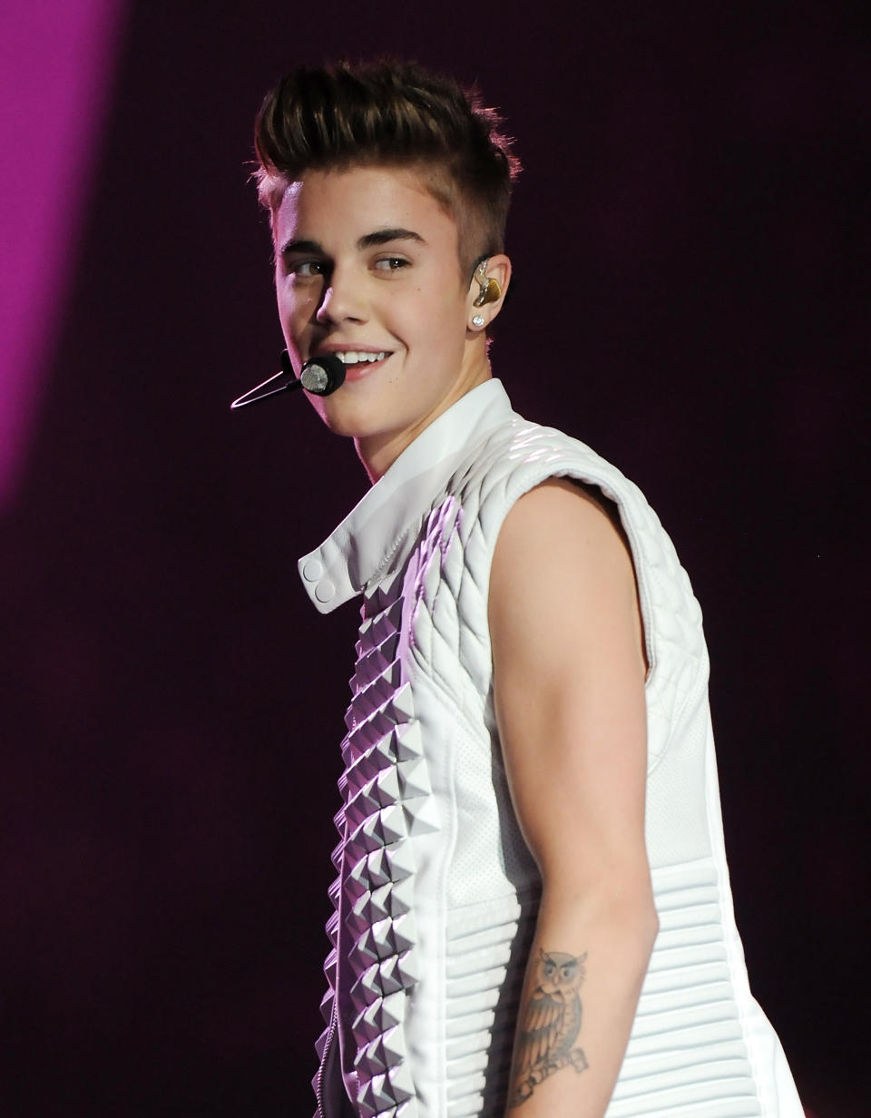 FILE - This Nov. 7, 2012 file photo shows singer Justin Bieber performing during the 2012 Victoria's Secret Fashion Show in New York. A former bodyguard for Bieber sued the pop superstar Thursday Jan. 10, 2013, claiming the singer repeatedly hit him during an incident last year and owes him more than $420,000 in unpaid wages. (Photo by Evan Agostini/Invision/AP)