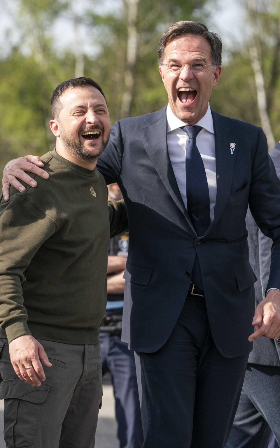 Ukrainian President Volodymyr Zelensky (L) and Dutch Prime Minister Mark Rutte (R) share a laugh as they visit the military base Camp Soesterberg, Netherlands, 04 May 2023 - JEROEN JUMELET/EPA-EFE/Shutterstock/Shutterstock