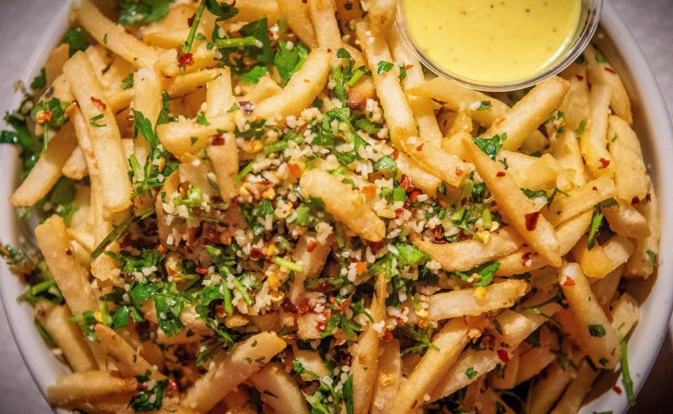 The famous garlic fries at FARMbloomington come with Parmesan, garlic, herbs, chili flakes and lemon zest.
