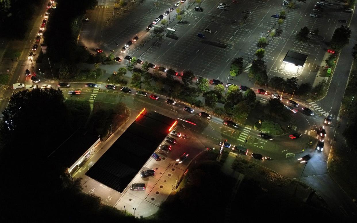 Drivers queue on Saturday night at a Sainsbury's petrol station in Ashford, Kent - Gareth Fuller / PA