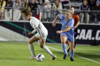 North Carolina's Avery Patterson (15) moves the ball after taking it from Florida State's Heather Payne, left, during the first half of an NCAA women's soccer tournament semifinal in Cary, N.C., Friday, Dec. 2, 2022. (AP Photo/Karl B DeBlaker)