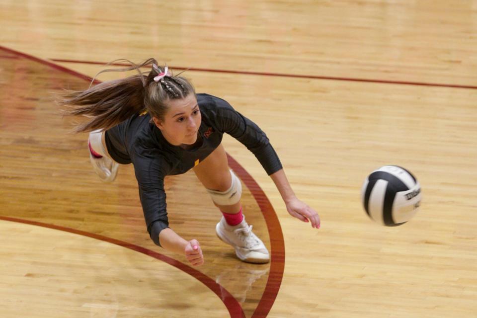 McCutcheon's Raegan Burns (4) dives for the ball during the second set of an IHSAA volleyball game, Tuesday, Oct. 5, 2021 in Lafayette.