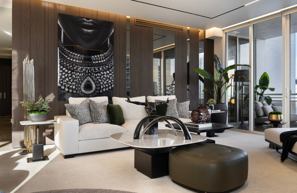 Adriana Hoyos Design Studio devised a Brickell Key apartment where elegance and sensuality intertwine, creating a harmonious space that exudes sophistication. The firm intended to create a masculine, elegant, and timeless space, using dark wood, light leather, and metallic accents.