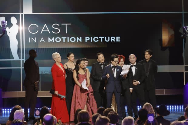 Jamie Lee Curtis, Jenny Slate, Stephanie Hsu, James Hong, Ke Huy Quan, Andy Le, Brian Le and Harry Shum Jr. accept the Outstanding Performance by a Cast in a Motion Picture award for "Everything Everywhere All at Once" onstage during the 29th Annual Screen Actors Guild Awards at Fairmont Century Plaza on Feb. 26, 2023, in Los Angeles.<p><a href="https://www.gettyimages.com/detail/1469874104" rel="nofollow noopener" target="_blank" data-ylk="slk:Kevin Winter/Getty Images;elm:context_link;itc:0;sec:content-canvas" class="link ">Kevin Winter/Getty Images</a></p>