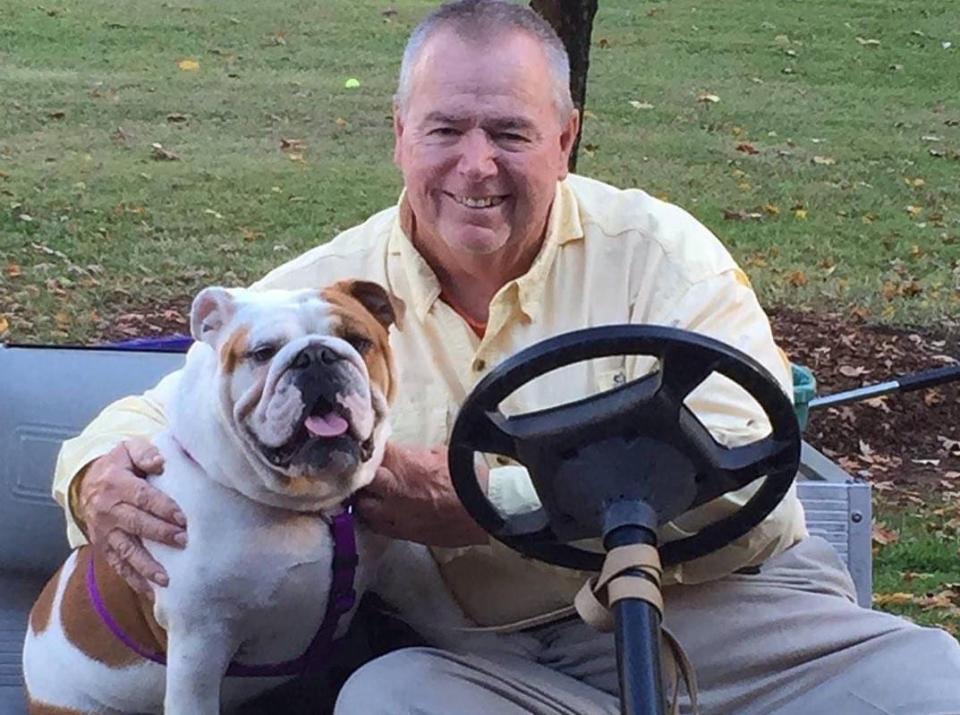 Legendary Burns football coach Ron Greene with one of the school's beloved canine mascots.