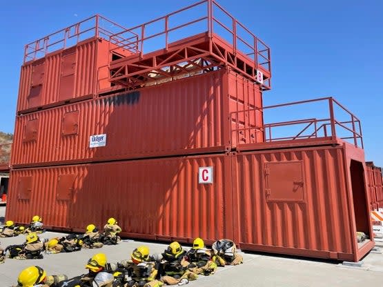 Firefighters training in San Diego use shipping containers to mimic burning buildings (Louise Boyle)