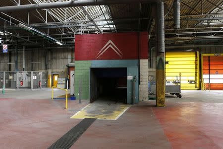 General view of an empty car production building at the PSA-Peugeot Citroen automobile plant in Aulnay-sous-Bois, near Paris, in this July 4, 2013 file photo. REUTERS/Benoit Tessier/Files