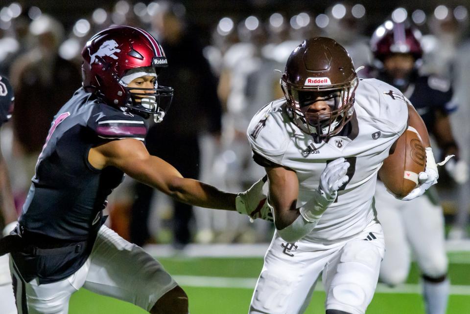 Peoria High's Spencer Russell tries to chase down Joliet Catholic running back Hiram J. Grigsby III in the second half of their Class 5A first-round state football playoff game Friday, Oct. 27, 2023 at Peoria Stadium.