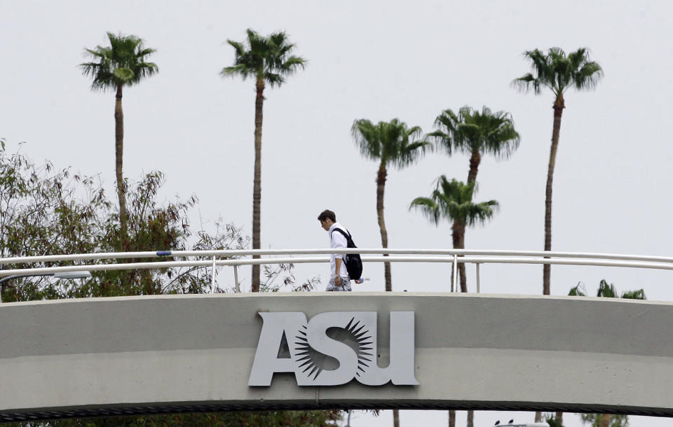 A student walks to class at Arizona State University in Tempe on July 10, 2007.  (Ross D. Franklin / AP file )