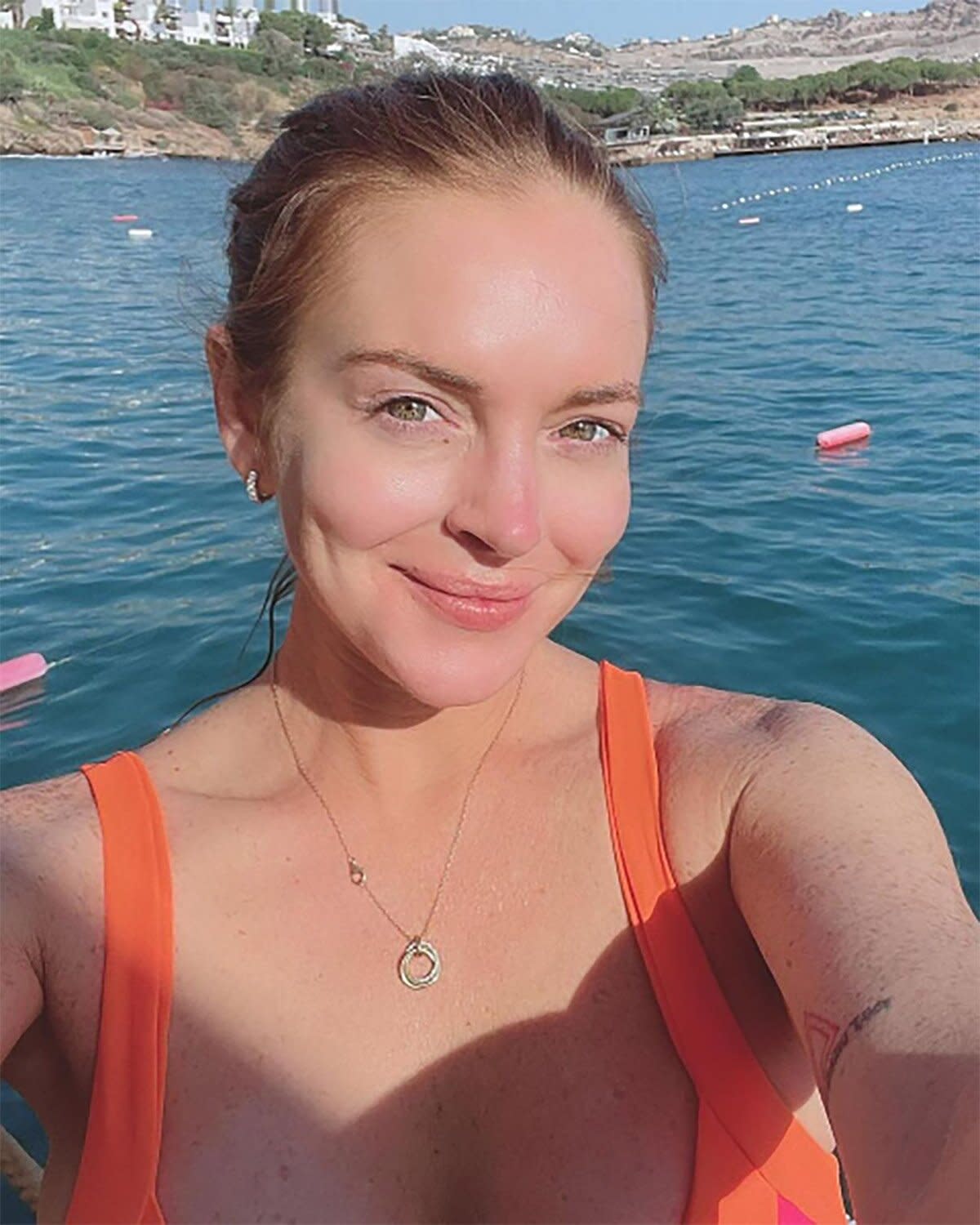 Lindsay Lohan Has 'Fun in the Sun' on the Turkish Riviera Following Wedding to Fiancé Bader Shamma Tout: can I get this picture from her Instagram? https://www.instagram.com/p/CftfoNVLHmC/