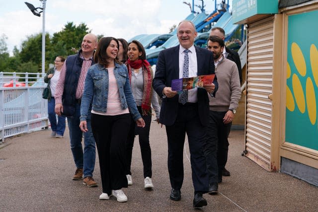 Sir Ed Davey, with Sarah Olney and Munira Wilson