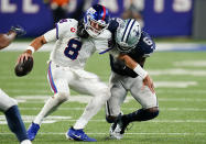 New York Giants quarterback Daniel Jones (8) is sacked by Dallas Cowboys safety Donovan Wilson (6) during the fourth quarter of an NFL football game, Monday, Sept. 26, 2022, in East Rutherford, N.J. (AP Photo/Frank Franklin II)