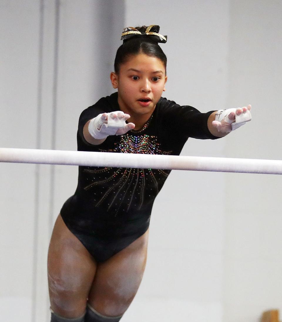 Gymnast compete in the Section 1 gymnastics championships at Eclipse Gymnastics in Mahopac Feb. 8, 2024.