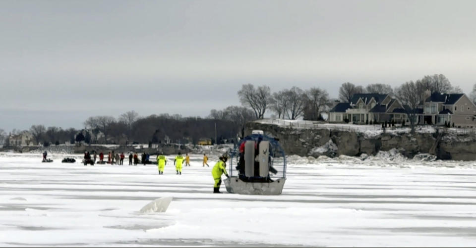 In this image taken from video provided by the U.S. Coast Guard, U.S. Coast Guard Air Station Detroit and Station Marblehead respond to a report of ice fishermen stranded on an ice floe near Catawba Island on Lake Erie, Ohio, Monday, Jan. 22, 2024. Twenty people were rescued from an ice floe in Lake Erie, the Coast Guard said Monday. (U.S. Coast Guard via AP)