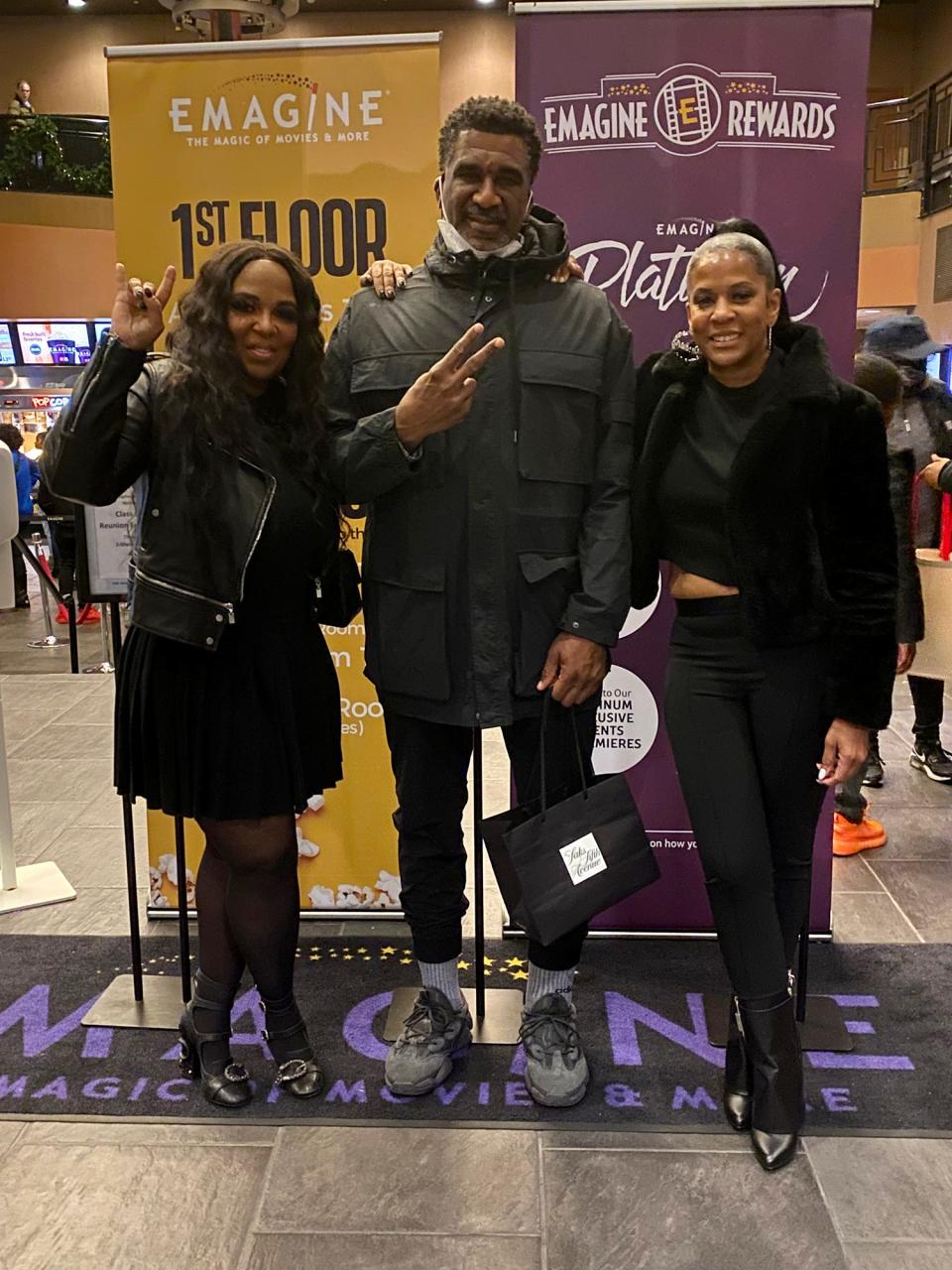 Dorothy Burston of “Tuff Cookiez,” left, Horatio Williams, founder of The Horatio Williams Foundation, and Tonesa Welch of SylentHeart Foundation all pose together after the "King Richard" screening in the lobby of the Emagine Theatre in Royal Oak on Nov 20, 2021.