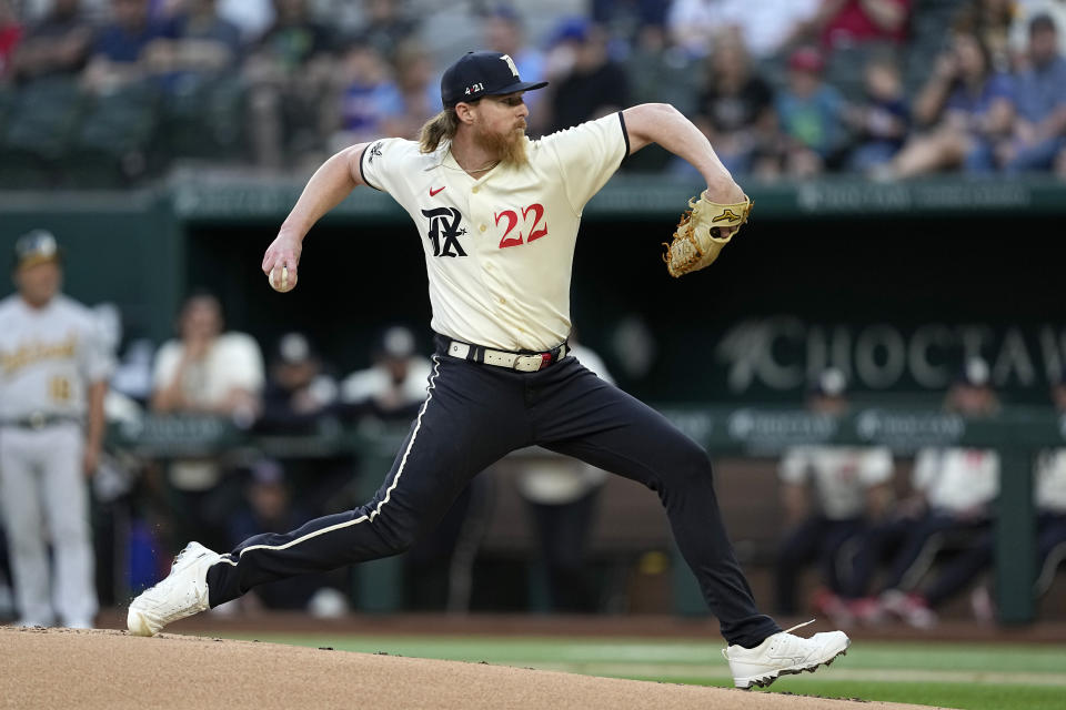 Texas Rangers starting pitcher Jon Gray throws to an Oakland Athletics batter during the first inning of a baseball game Friday, April 21, 2023, in Arlington, Texas. (AP Photo/Tony Gutierrez)