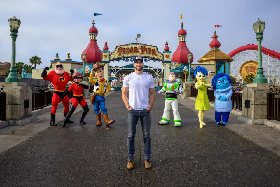 Chris Evans poses with Pixar characters at Disneyland on June 11, 2022.