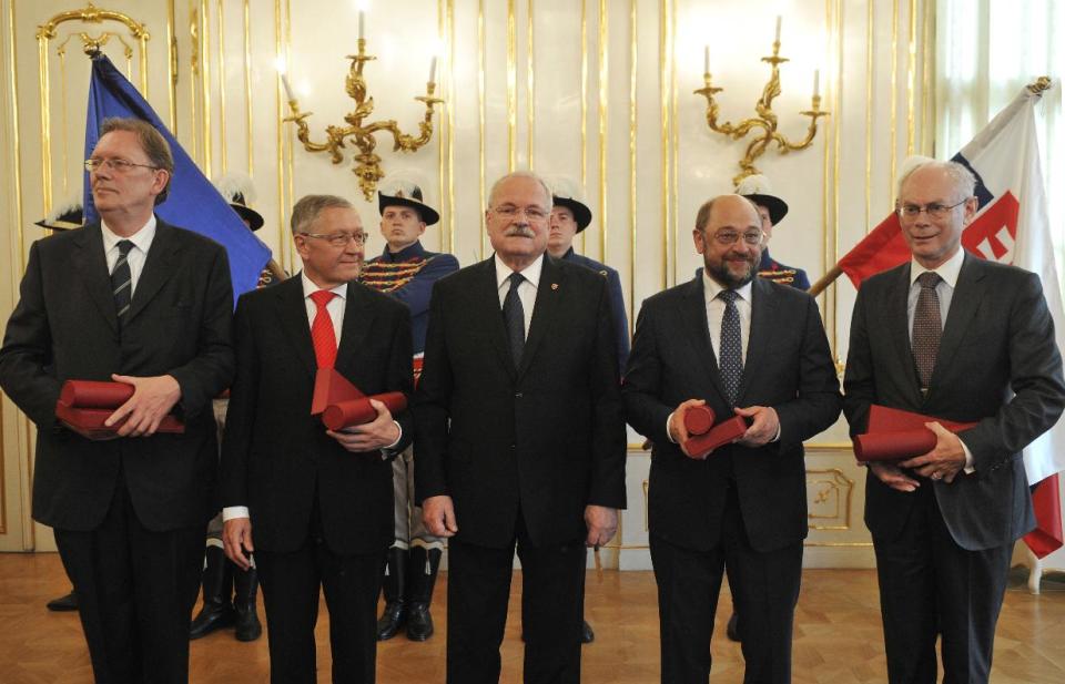 From left, member of the European Parliament's Committee on Foreign Affairs Jan Marinus Wiersma, Chief Executive Officer of the European Financial Stability Facility Klaus Regling, Slovakian president Ivan Gasparovic, President of the European Parliament Martin Schulz and European president Herman Van Rompuy pose for media after presentations of the Order of the White Double Cross, a high Slovak state decoration, at the occasion of the 10th anniversary of the Slovakian entrance into EU in Bratislava, Slovakia, on Wednesday, April 30, 2014. (AP Photo,CTK/Jan Koller) SLOVAKIA O