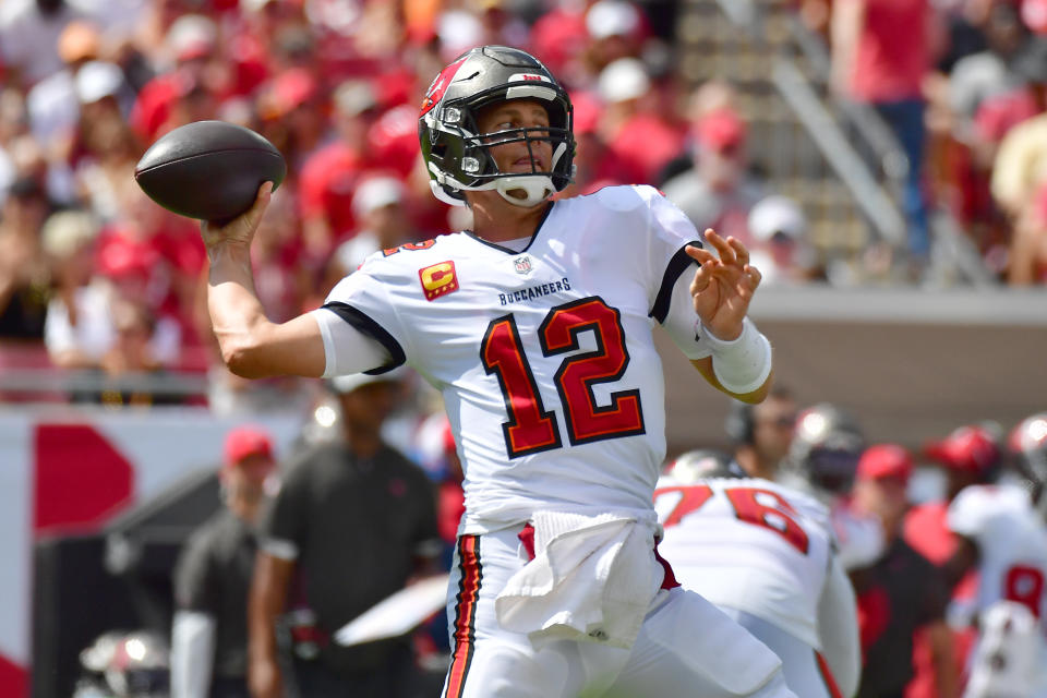 TAMPA, FLORIDA - OCTOBER 10: Tom Brady #12 of the Tampa Bay Buccaneers throws a pass during the second quarter against the Miami Dolphins at Raymond James Stadium on October 10, 2021 in Tampa, Florida. (Photo by Julio Aguilar/Getty Images)