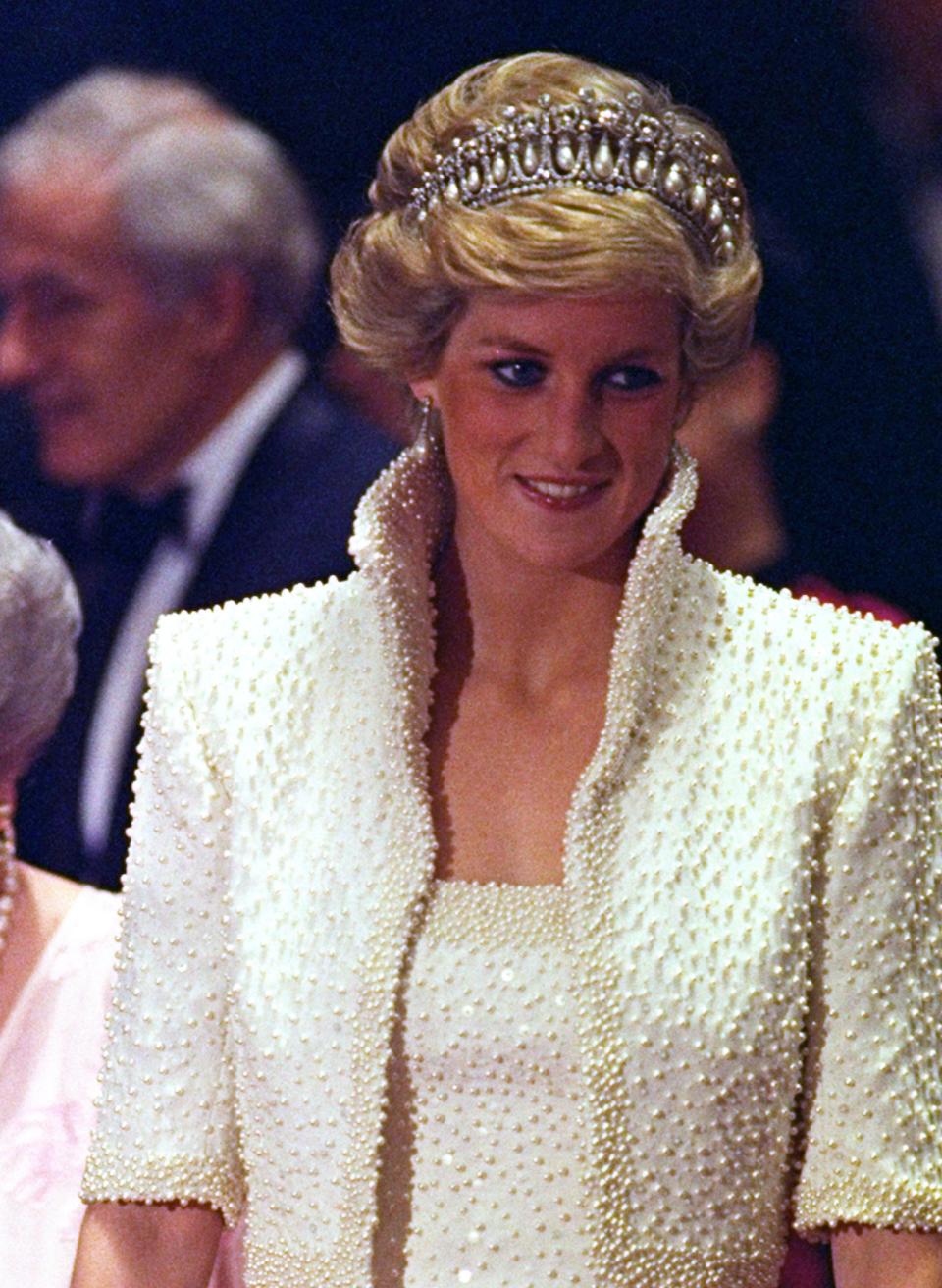Princess Diana on an official visit to Hong Kong in November 1989. The dress is included in 'Diana: Her Fashion Story' that opened at Kensington Palace in February 2017.