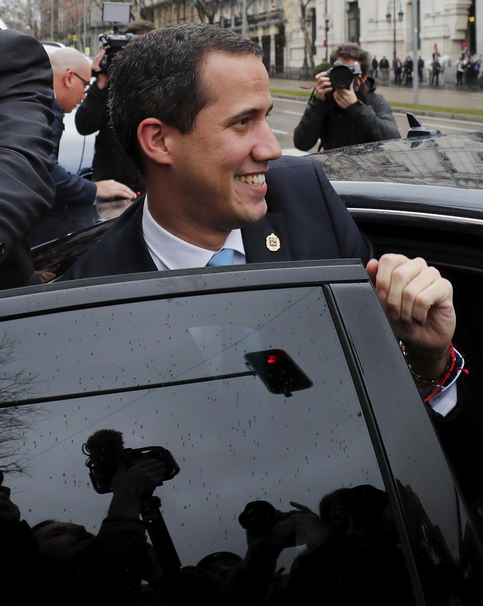 The leader of Venezuela's political opposition Juan Guaido gets into a car during a visit to Madrid, Spain, Saturday, Jan. 25, 2020. Juan Guaido, the man who one year ago launched a bid to oust Venezuelan President Nicolas Maduro, arrived Saturday in Spain, where a thriving community of Venezuelans and a storm among Spanish political parties awaited him. (AP Photo/Paul White)