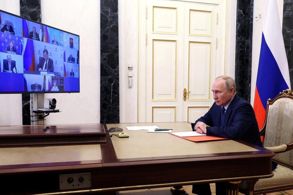 Russian president Vladimir Putin chairs a meeting with members of the Security Council via a video link in Moscow, Russia 26 May 2023 (Reuters)