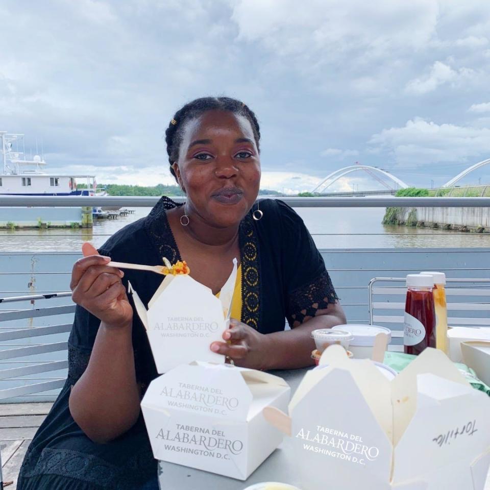 writer eating chinese food out of white takeout container