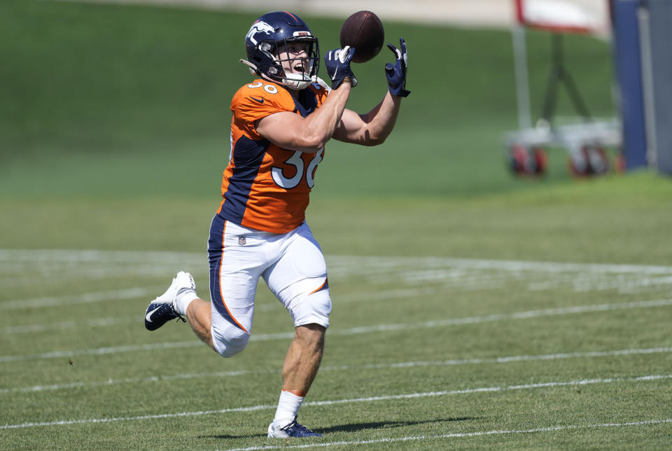 Denver Broncos running back Max Borghi takes part in drills during the NFL football team's training camp Thursday, Aug. 4, 2022, at the Broncos' headquarters in Centennial, Colo. (AP Photo/David Zalubowski)