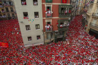 <p>Revellers enjoy the atmosphere during the opening day or ‘Chupinazo’ of the San Fermin Running of the Bulls fiesta on July 6, 2018 in Pamplona, Spain. (Photo: Pablo Blazquez Dominguez/Getty Images) </p>