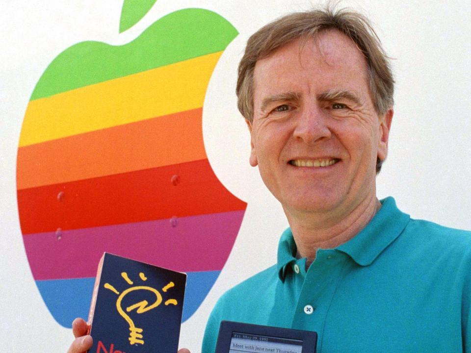 Apple Computer Inc. president and chief executive John Sculley holds a proposed model prototype at Apple's headquarters in Cupertino, Calif., May 28, 1992, of their new Personal Digital Assistant (PDA), using Newton's technology. Apple will preview the handheld, pen-controlled Newton at the Consumer Electronics Show on Friday. (AP Photo/Paul Sakuma)