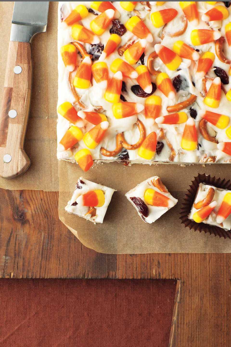 <p>This candy corn fudge recipe also contains salty pretzels and delicious cream cheese.</p><p>Get the <strong><a href="https://www.womansday.com/food-recipes/food-drinks/recipes/a11819/candy-corn-fudge-recipe-123647/" rel="nofollow noopener" target="_blank" data-ylk="slk:Candy Corn Fudge recipe;elm:context_link;itc:0;sec:content-canvas" class="link ">Candy Corn Fudge recipe</a></strong>.</p>