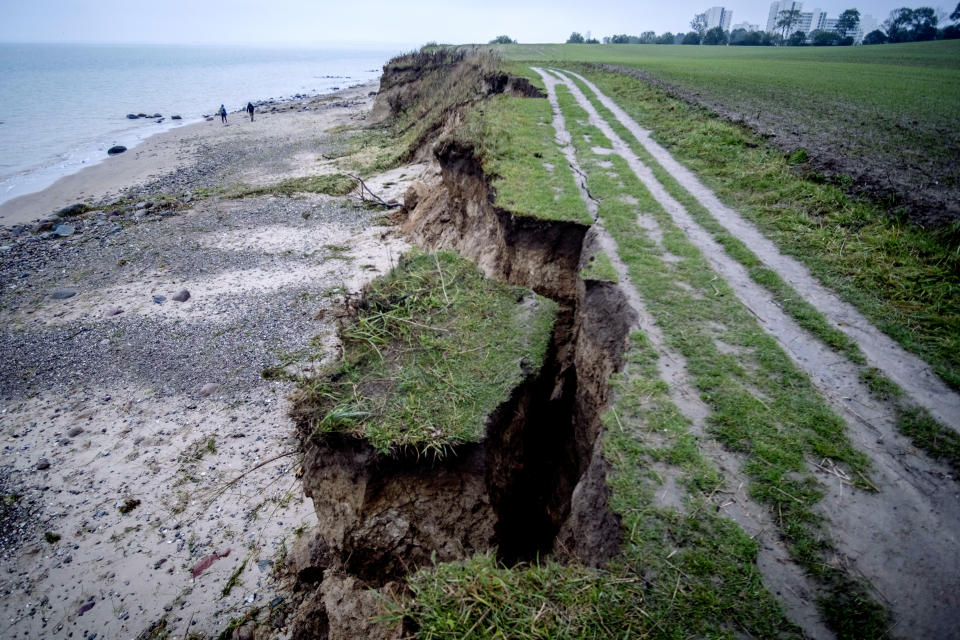 A part of a steep bank at the Baltic Sea is broken off during heavy storms the night before in Sierksdorf, northern Germany, Saturday, Oct. 21, 2023. (AP Photo/Michael Probst)