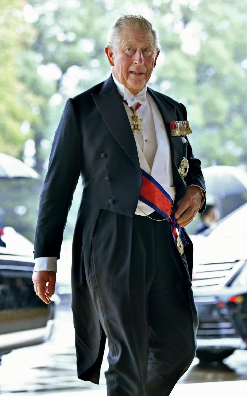 Britain's Prince Charles arrives for the Imperial Palace to attend the enthronement ceremony of Japan's Emperor Naruhito in Tokyo, Tuesday, Oct. 22, 2019. Japan's Naruhito proclaimed himself Emperor during an enthronement ceremony at the Imperial Palace, declaring himself the country's 126th monarch.(Kyodo News via AP)