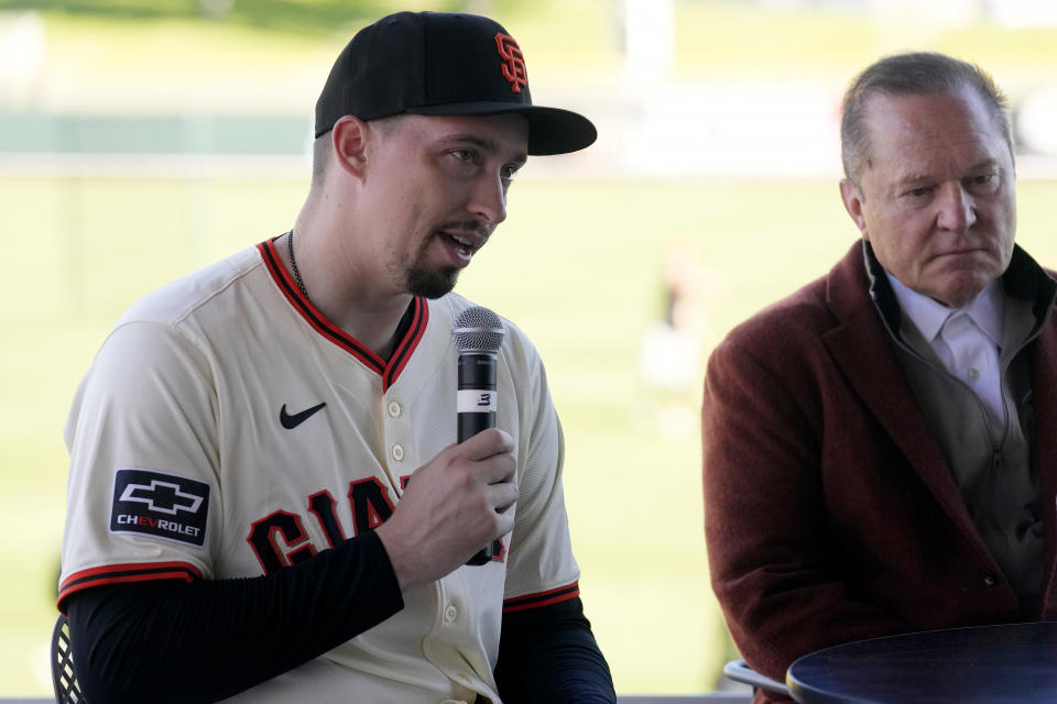 New San Francisco Giants pitcher Blake Snell, left, speaks as he is introduced during a news conference as agent Scott Boras, right, listens Wednesday, March 20, 2024, in Scottsdale, Ariz. (AP Photo/Ross D. Franklin)