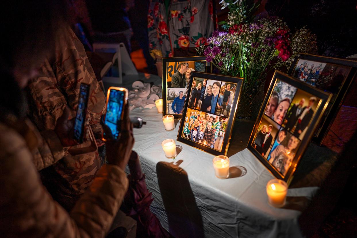 A candlelight vigil for Riley Strain, held on the same street where footage last captured him alive (AP)