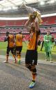 Britain Soccer Football - Hull City v Sheffield Wednesday - Sky Bet Football League Championship Play-Off Final - Wembley Stadium - 28/5/16 Hull City's David Meyler celebrates winning promotion back to the Premier League with the trophy Action Images via Reuters / Andrew Couldridge Livepic EDITORIAL USE ONLY. No use with unauthorized audio, video, data, fixture lists, club/league logos or "live" services. Online in-match use limited to 45 images, no video emulation. No use in betting, games or single club/league/player publications. Please contact your account representative for further details.
