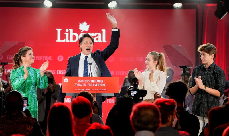 Canada's Liberal Prime Minister Justin Trudeau, accompanied by his wife Sophie Gregoire and their children Ella-Grace and Xavier, waves to supporters during the Liberal election night party in Montreal