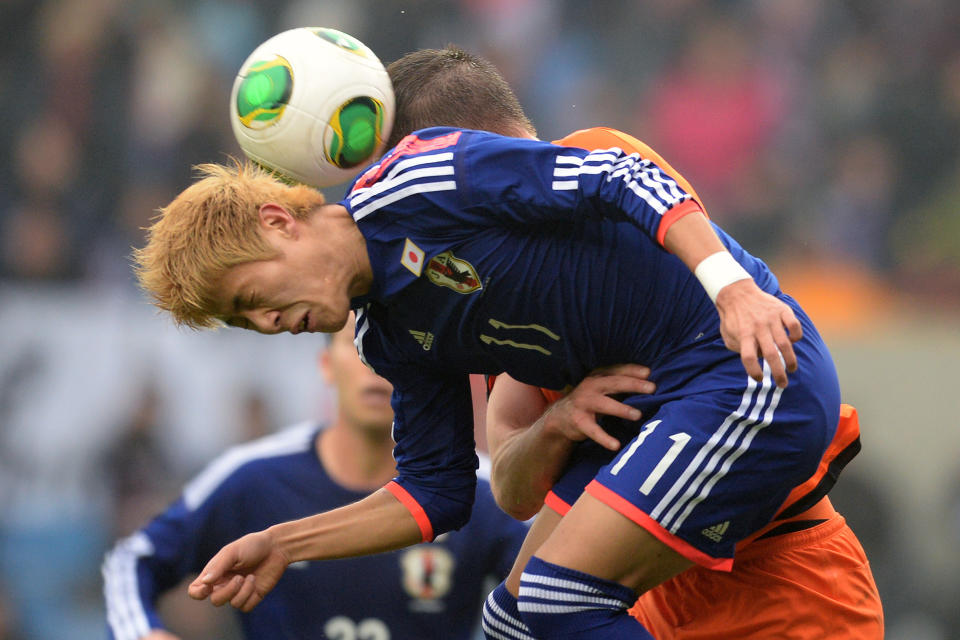 FILE - In this Nov. 16, 2013 photo, Japan's Yoichiro Kakitani, front, challenges Stefan de Vrij from the Netherlands during a friendly soccer match at the Fenix stadium in Genk, Belgium. Kakitani's goal drought in the J-League has put his position in Japan's World Cup squad in jeopardy. Once considered a lock for Brazil, the 24-year-old attacking midfielder has yet to score for Cerezo Osaka in 10 J-League matches this season. d (AP Photo/Geert Vanden Wijngaert, File)