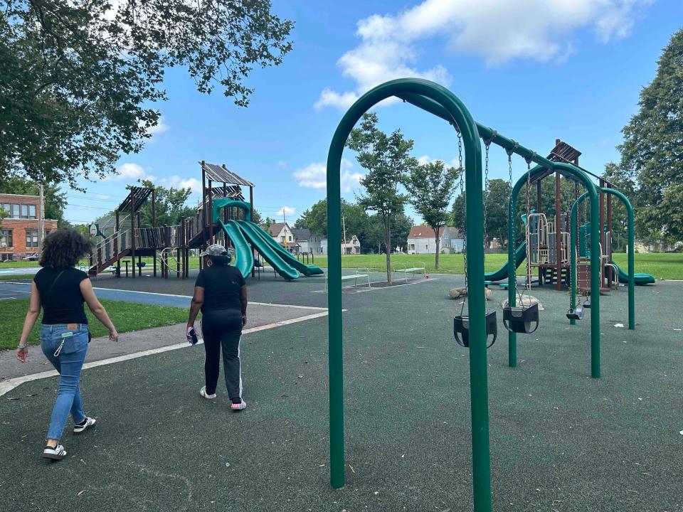 Maryann Batlle (left) and Inez Burns (right) walk through a playground near Central Park in Rochester, N.Y. on Jul. 31, 2021.