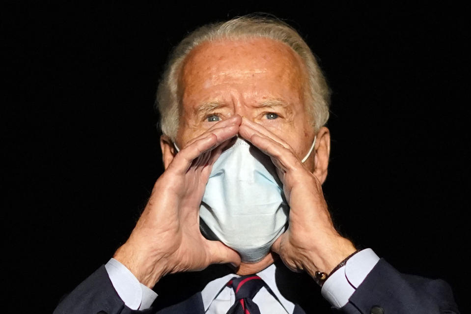 Democratic presidential candidate former Vice President Joe Biden speaks to reporters before he boards his campaign plane at Cincinnati/Northern Kentucky International Airport, in Hebron, Ky., Monday, Oct. 12, 2020, en route to Wilmington, Del. (AP Photo/Carolyn Kaster)