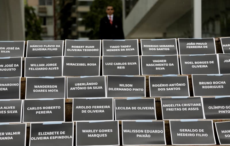 FILE PHOTO: Placards with names of victims of a collapsed tailings dam owned by Vale SA are placed in front of the Brazilian mining company Vale SA bulding, during an assembly of shareholders, in Rio de Janeiro